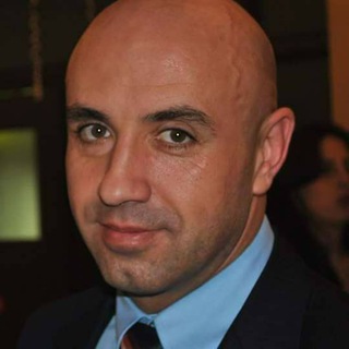 ADRiAN ROBERTiN DiNU